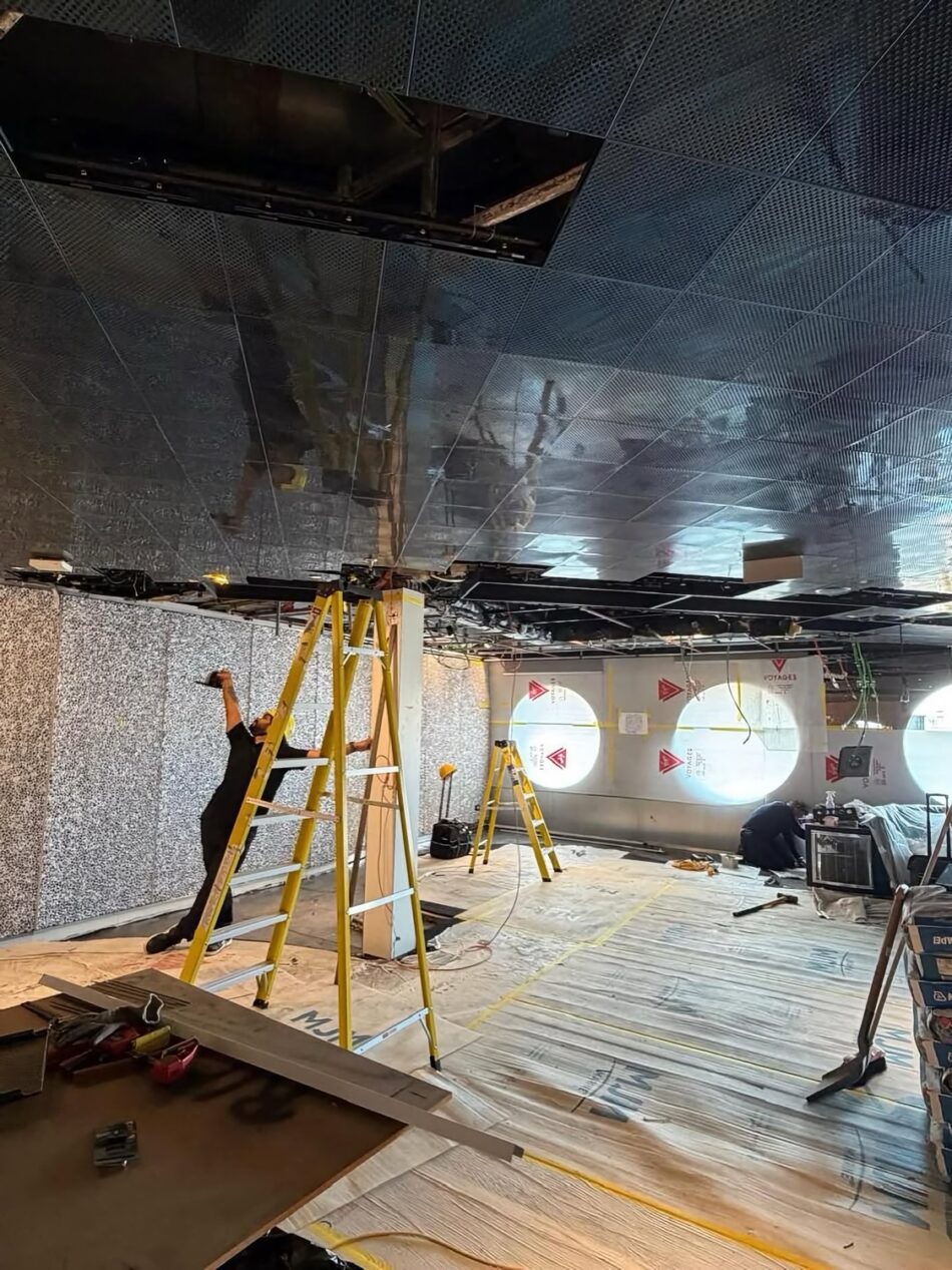 Virgin Voyages cruise ship cabin undergoing renovation with ladders and construction equipment