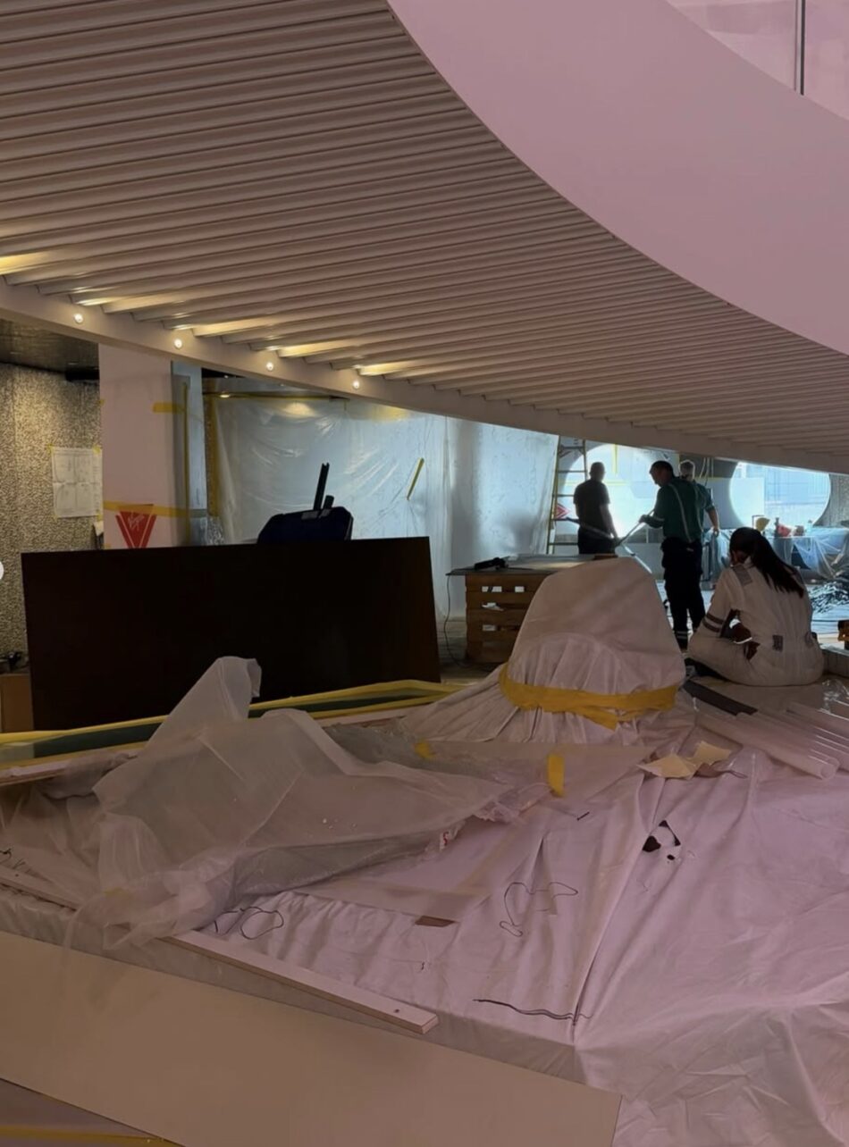 Virgin Voyages cabin under construction on a cruise ship with workers
