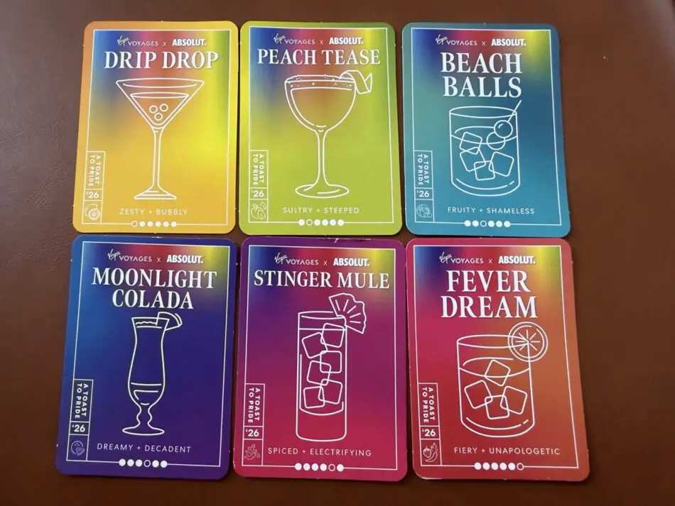 Colorful Virgin Voyages cocktail cards displaying drink names on a cruise ship