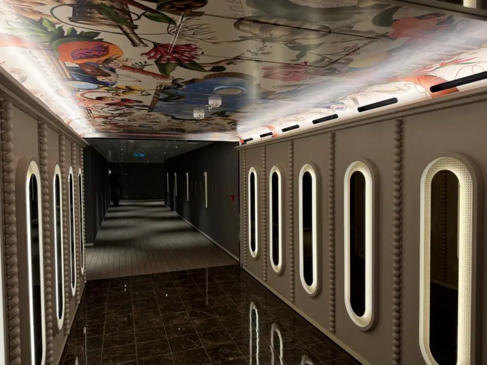 Long cruise ship corridor with a colorful ceiling mural and illuminated arched door panels on a Virgin Voyages cruise ship