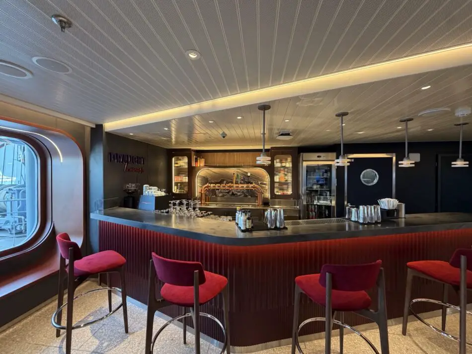 Bar interior with copper taps on a Virgin Voyages cruise ship