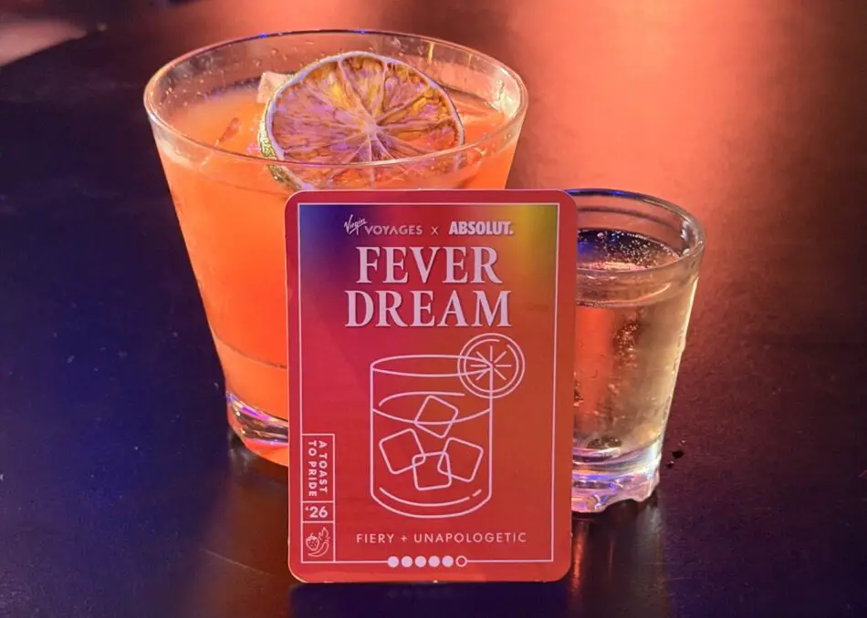 Two cocktails with Fever Dream card on a Virgin Voyages cruise ship bar