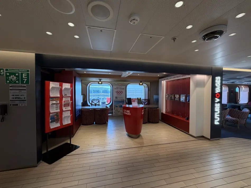 Reception area on a Virgin Voyages cruise ship with Future Voyages display