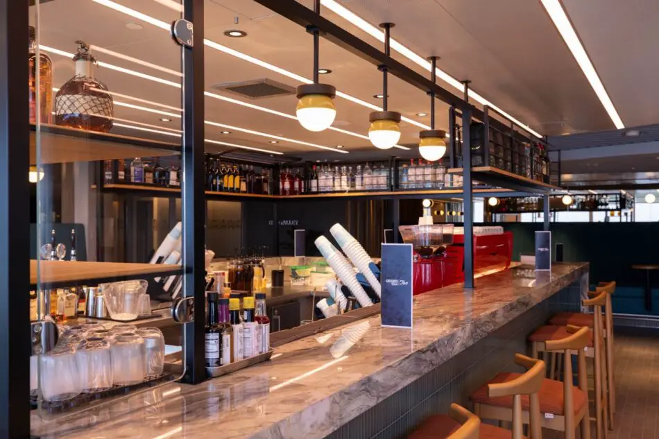Bar area on a Virgin Voyages cruise ship with a marble counter