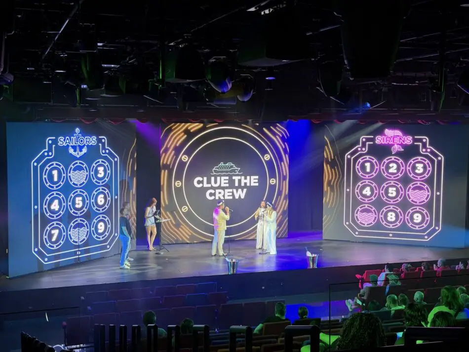 Stage show on a Virgin Voyages cruise ship with Clue the Crew center display