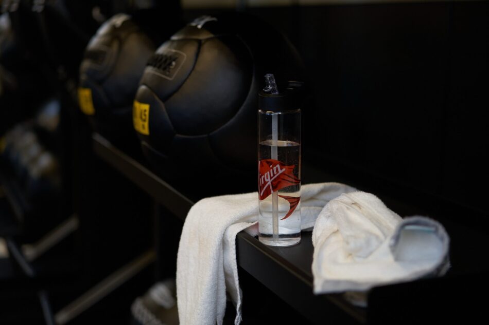 Water bottle with Virgin logo in a Virgin Voyages cabin