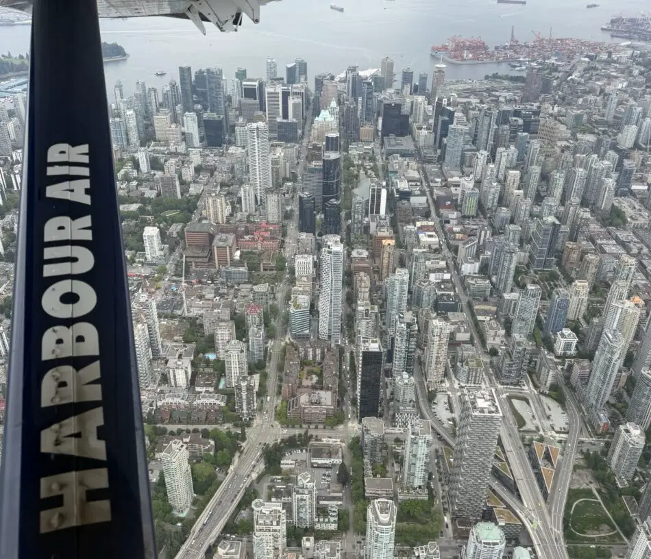 Aerial view of a dense city skyline by the harbor