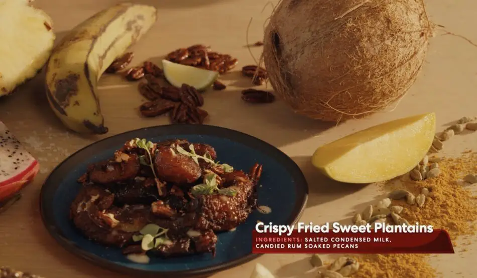 Crispy Fried Sweet Plantains on a plate with tropical fruits
