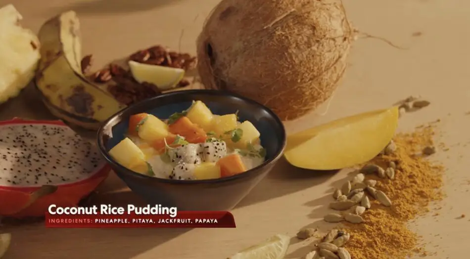 Coconut rice pudding with pineapple, papaya, and dragon fruit