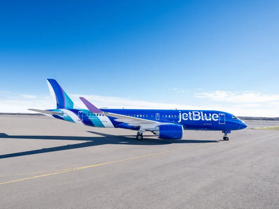 JetBlue aircraft parked on a wide airport tarmac