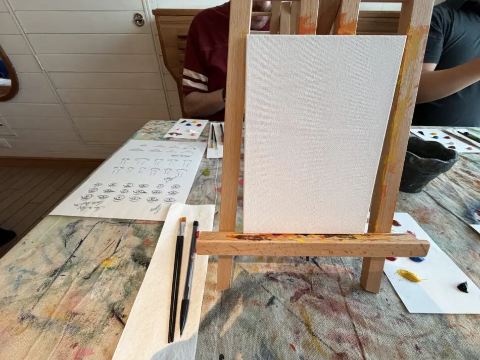 Artist's painting studio with blank canvas on a wooden easel