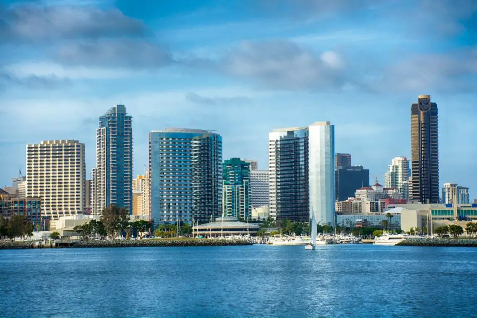 Waterfront city skyline with yachts and high-rise buildings