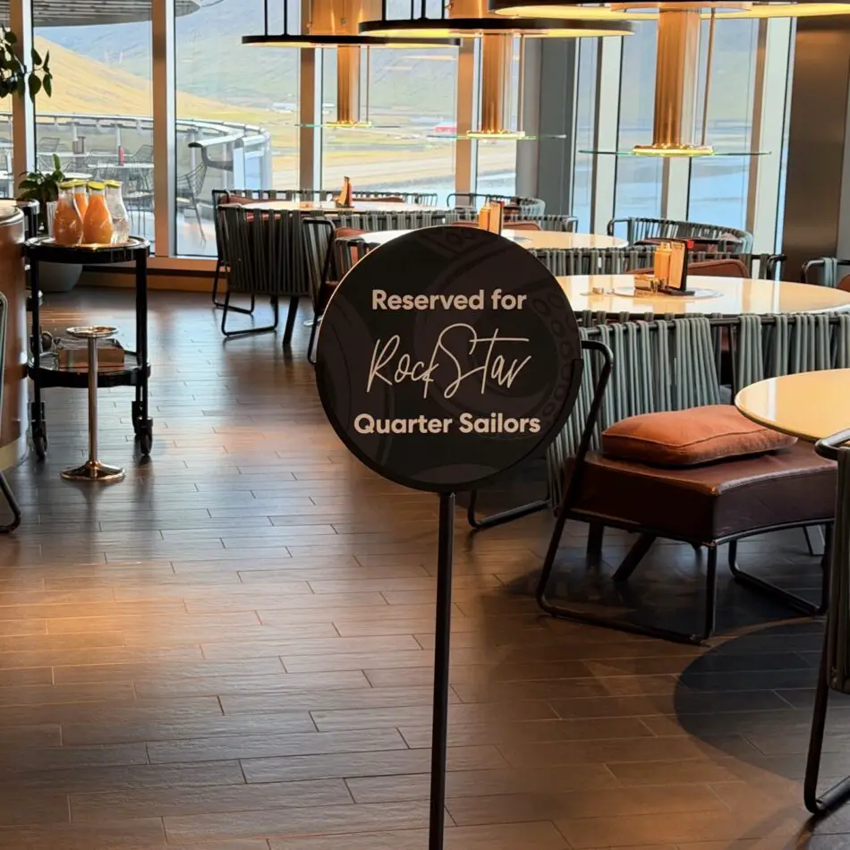 Dining area on a Virgin Voyages cruise ship with a sign reading Reserved for Rock Star Quarter Sailors