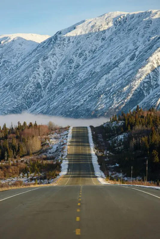 A road through the snowy mountain landscape around Haines, Alaska.