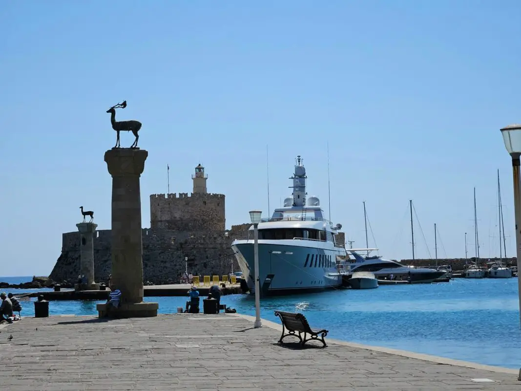 Mandraki harbour entrance in Rhodes, Greece