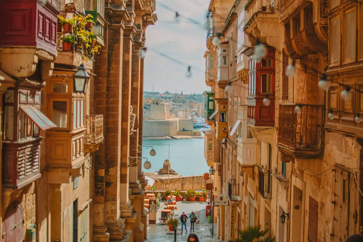 Traditional balconies and a harbour view in Valletta, Malta